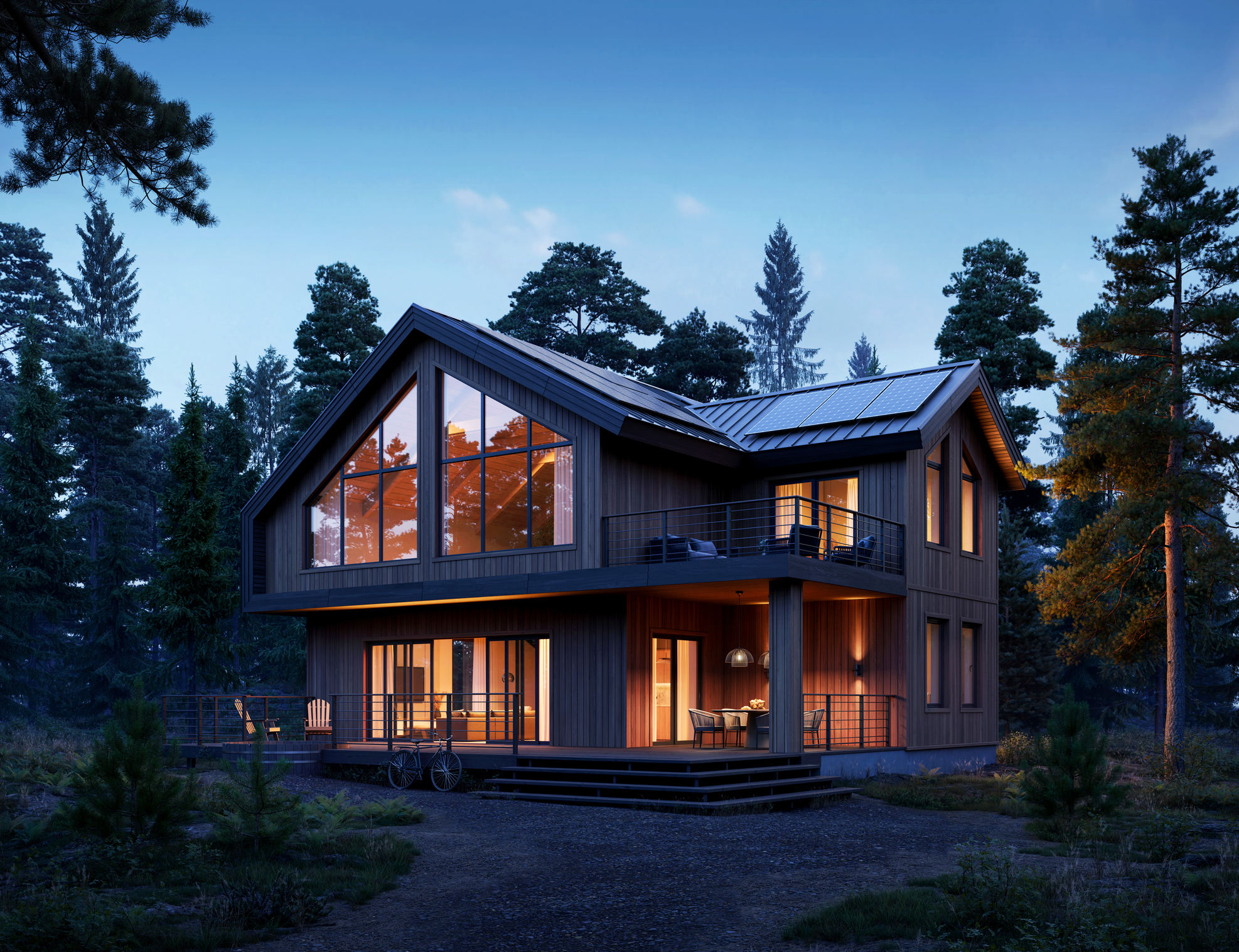 Modernes zweistöckiges Holzhaus in Waldlage mit großen Fenstern und Balkon, beleuchtet in der Abenddämmerung